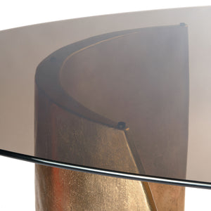Detail top view of Bangle cast bronze table with tinted glass top.