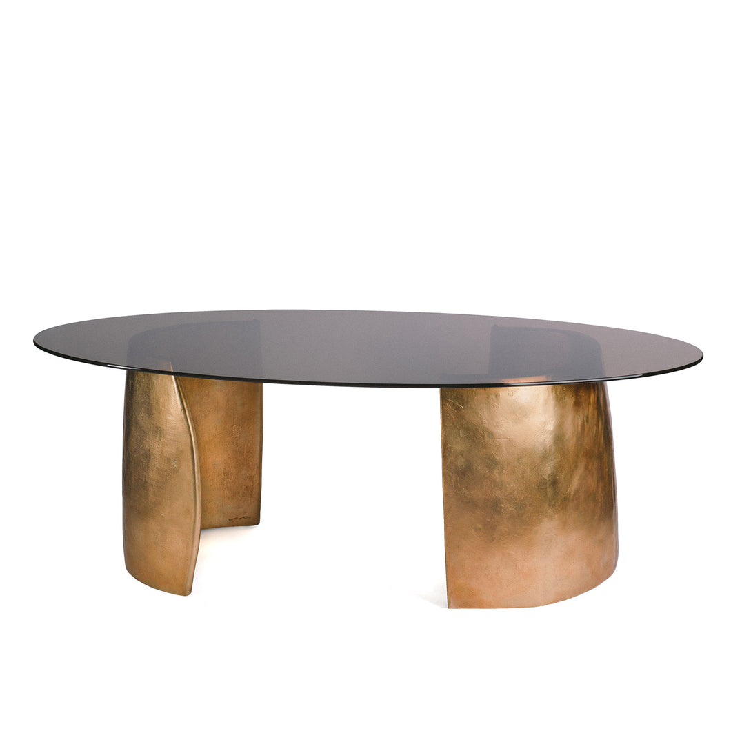 Bangle Table, Cast bronze table made of curved end pieces with tinted glass top.