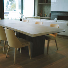 Load image into Gallery viewer, Worzel Table in dining room interior, blackened cast aluminum base with eco resin top 
